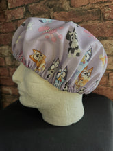 Load image into Gallery viewer, BLUEY & BINGO CARTOON CHARACTERS DANCING FUN PURPLE Medical Scrub Caps Unisex Men & Women Tie Back and Bouffant Hat Styles
