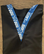 Load image into Gallery viewer, Solid Black Scrub Top with Detroit Lions Football Fabric on *Neck Band & Pocket Options* Medical Scrub Top Unisex Style Shirt for Men & Women