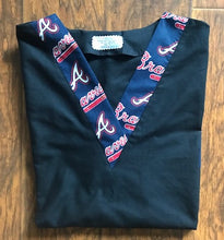 Load image into Gallery viewer, Solid Black Scrub Top with Atlanta Braves Baseball Fabric on *Neck Band & Pocket Options* Medical Scrub Top Unisex Style Shirt for Men & Women
