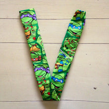 Load image into Gallery viewer, TMNT Teenage Mutant Ninja Turtles Donatello Michaelangelo Raphael Leonardo Faces Green Fabric Stethoscope sock cover for Medical Professionals