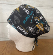 Load image into Gallery viewer, JACKSONVILLE JAGUARS PENNANTS FOOTBALL Unisex Medical Surgical Scrub Caps Men &amp; Women Tie Back and Bouffant Hat Styles
