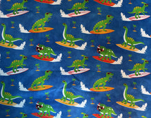 Load image into Gallery viewer, Fun in the Sun Surfing Dinosaurs with Sunglasses Medical Scrub Top Unisex Style for Men &amp; Women
