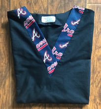 Load image into Gallery viewer, Solid Black Scrub Top with Atlanta Braves Baseball Fabric on *Neck Band &amp; Pocket Options* Medical Scrub Top Unisex Style Shirt for Men &amp; Women
