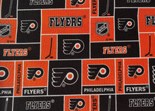 Load image into Gallery viewer, Solid Black Scrub Top with Featured Hockey Fabric on *Neck Band &amp; Pocket Options* Medical Scrub Top Unisex Style Shirt for Men &amp; Women
